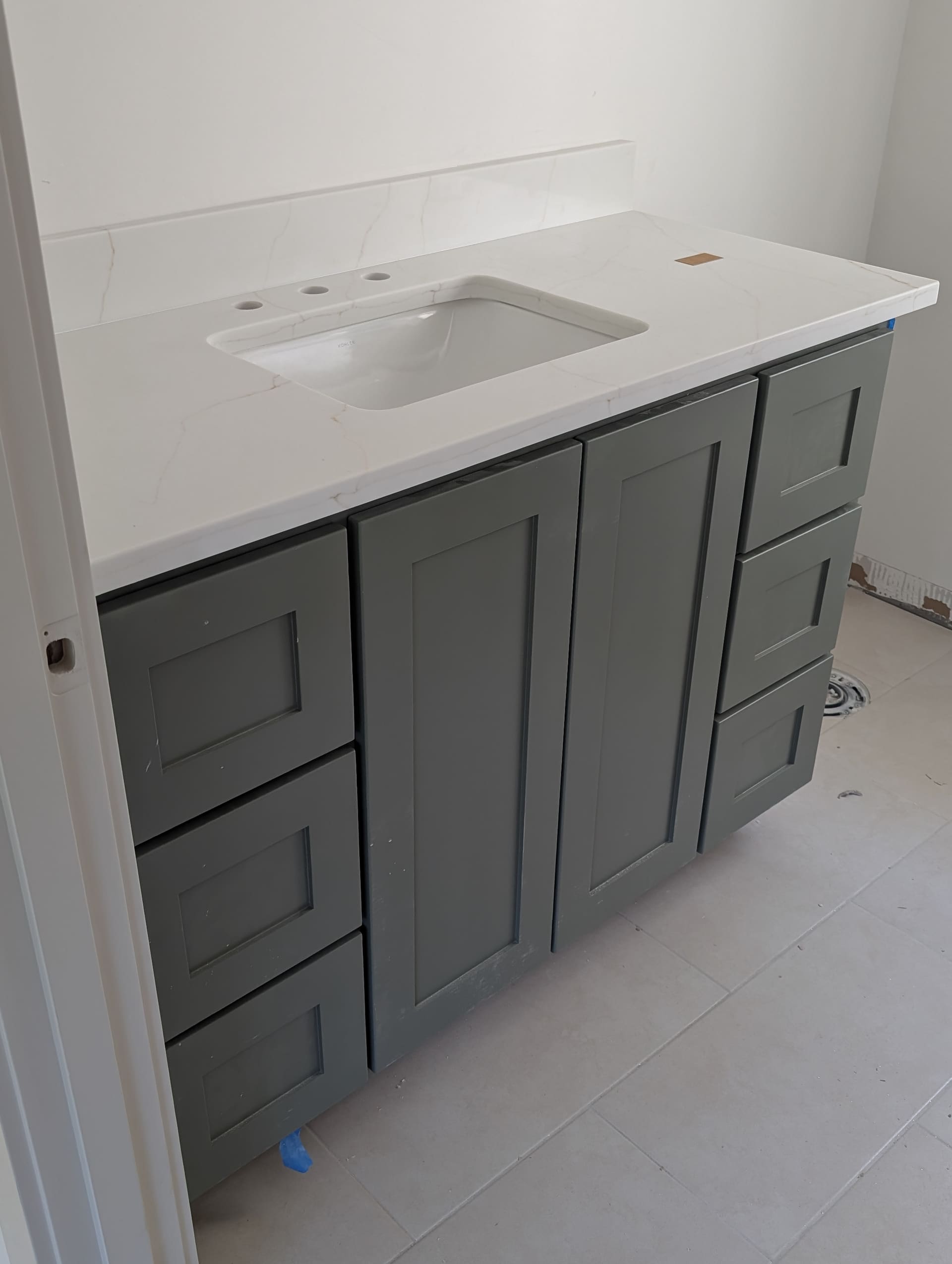 Custom bathroom vanity with quartz countertop and undermount sink